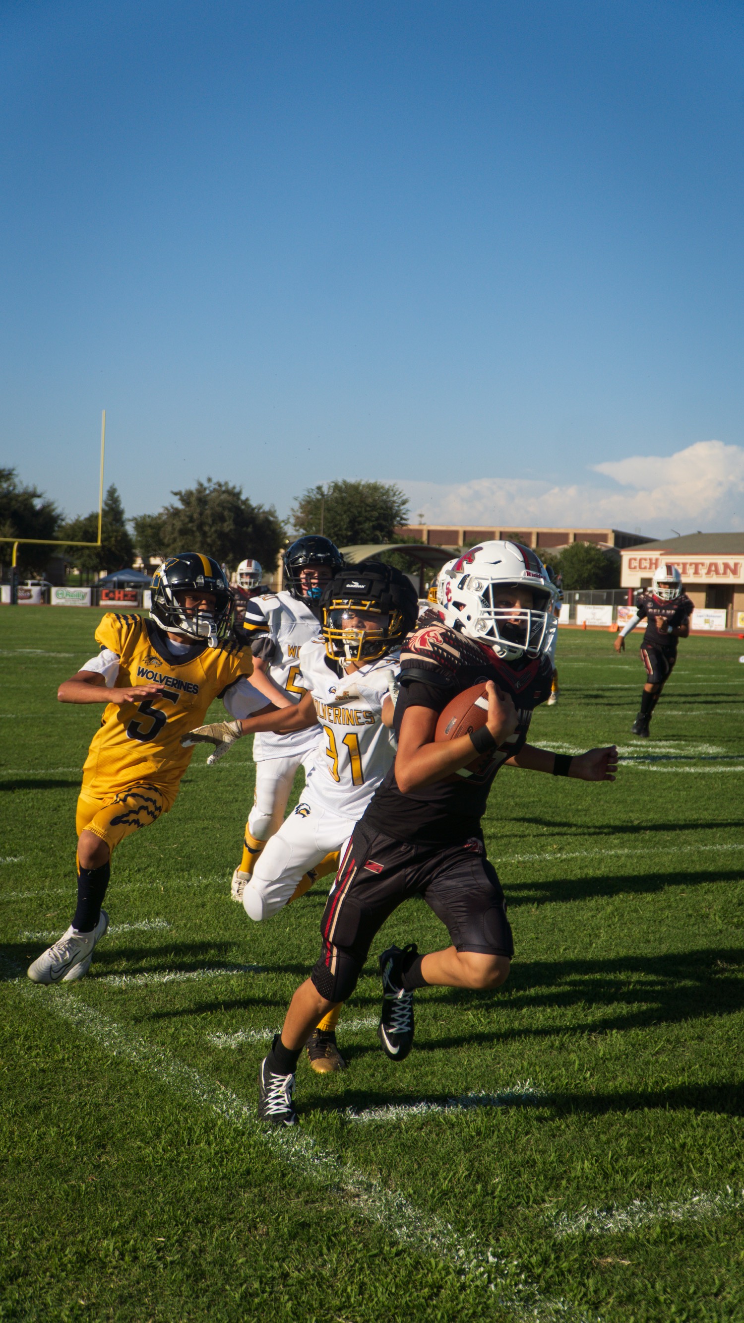 Youth football runner with the ball