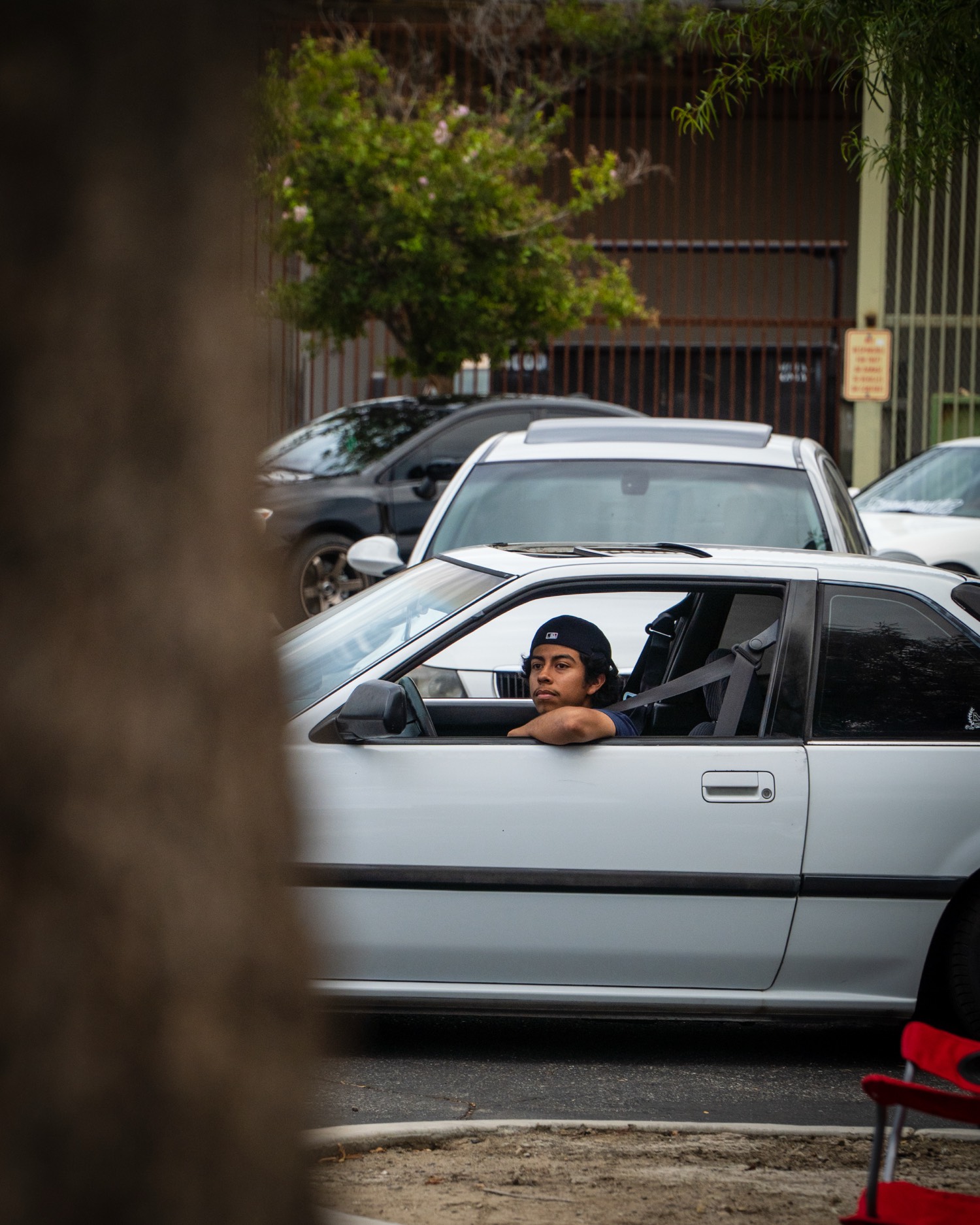 Driver leaning on a car window