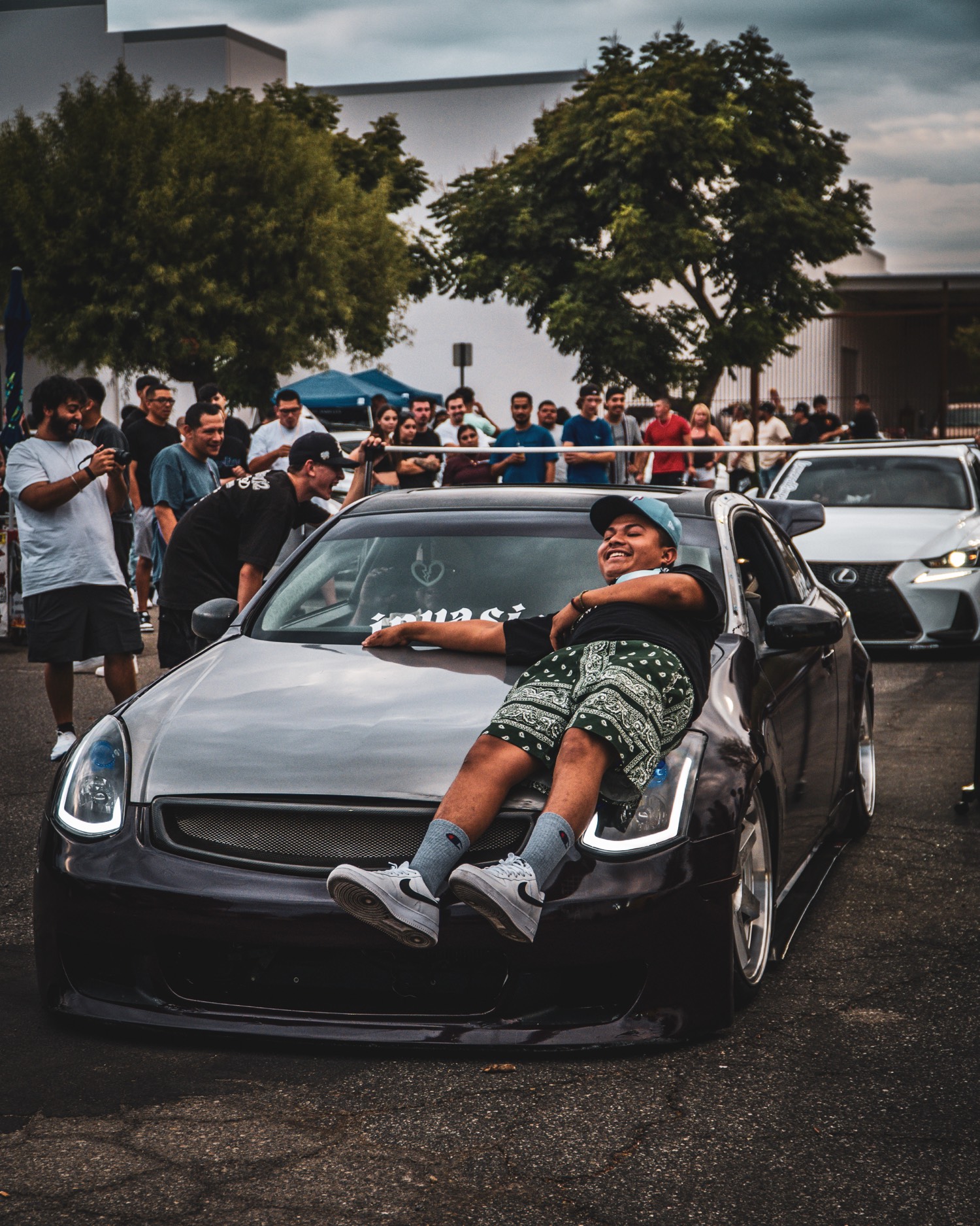 Driver reclining on a slammed coupe
