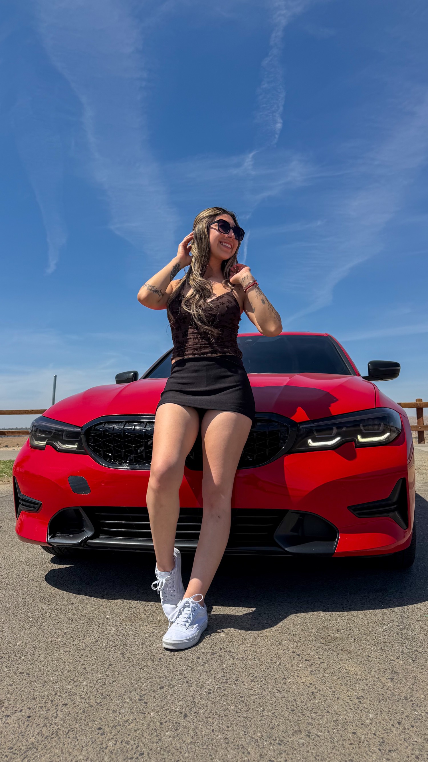 Portrait with a red BMW